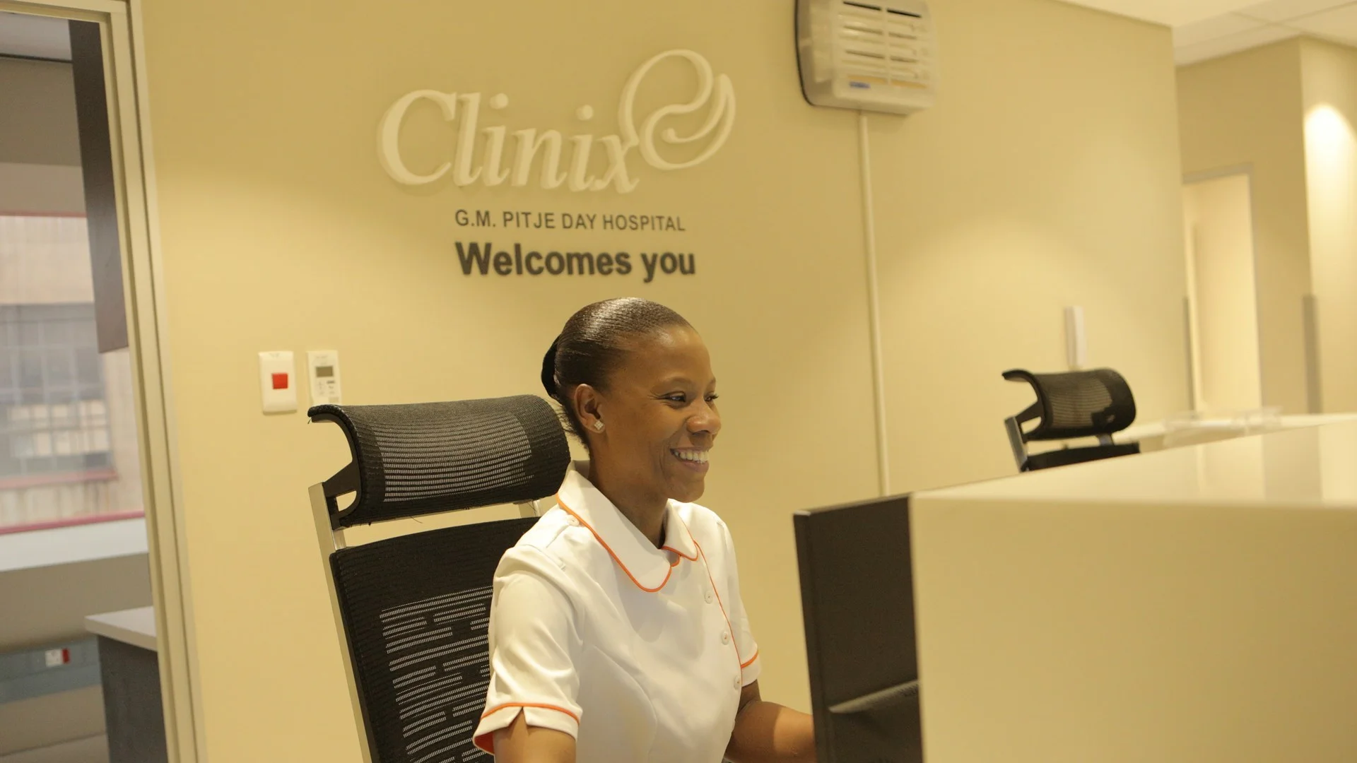 A composite graphic featuring the Clinix Health Group logo with its signature blue and green "human-centric" icon. The right side shows the modern entrance of the Dr. G.M. Pitje Day Hospital in Johannesburg, with blue window tinting and professional signage.